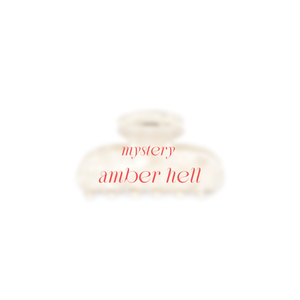 EIn Bild von der Amber Beige verschwommen mit dem Text in Rot Mystery Amber Hell